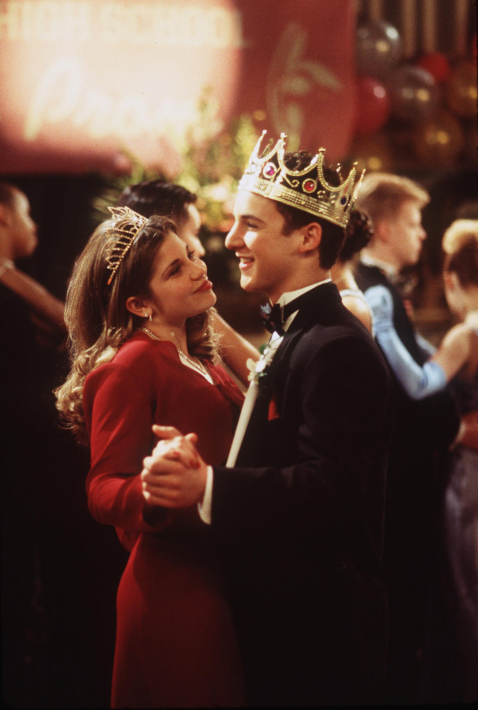 <p>Topanga (Danielle Fishel) and Cory (Ben Savage) manage to be crowned Prom Queen and King — it must have been Topanga’s eye-catching two-piece red dress. (Photo: ABC/Getty Images) </p>