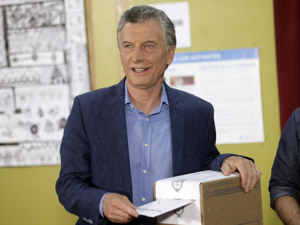 President Mauricio Macri votes in Buenos Aires, Argentina, Sunday, Oct. 27, 2019. Argentina could take a political turn in Sunday's presidential elections, with center-left Peronist candidate Alberto Fernandez favored to oust Macri amid growing frustration over the country's economic crisis.(AP Photo/Daniel Jayo)