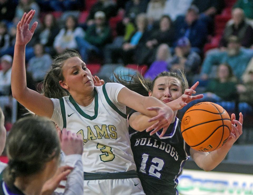 Sylvania’s Alli Murdock and Susan Moore’s Lani Smallwood battle for a rebound during high school basketball action in Jacksonville, Alabama February 17, 2024. (Dave Hyatt: The Gadsden Times)