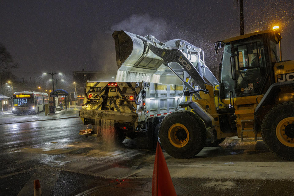 PennDot trucks load up on salt at their facility on Hunting Park on Friday, Jan. 19, 2024 in Philadelphia. The region is preparing for snow. (Alejandro A. Alvarez/The Philadelphia Inquirer via AP)