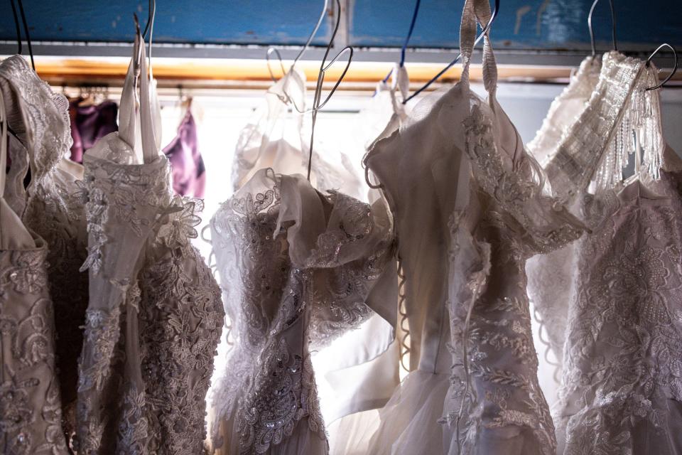 Wedding dresses hung inside a bridal rental shop in Harare, Zimbabwe, on Aug. 25, 2023.