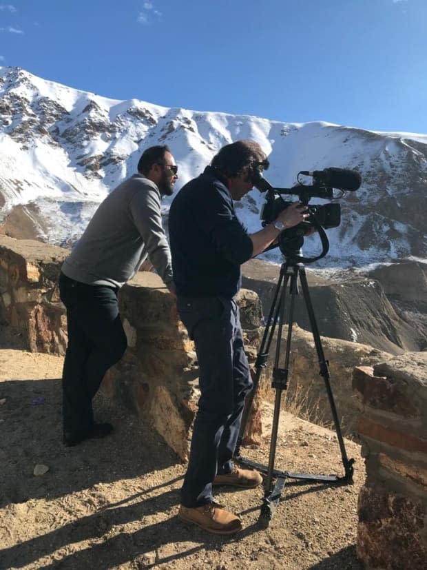 Saleem Yousofzada, left, is a Kabul-based filmmaker and father of three who is trying to get himself and his family asylum in Canada as the Taliban's grip on Afghanistan tightens. Filmmakers in the country fear for their lives under the new Taliban rule.   (Submitted by Saleem Yousofzada - image credit)