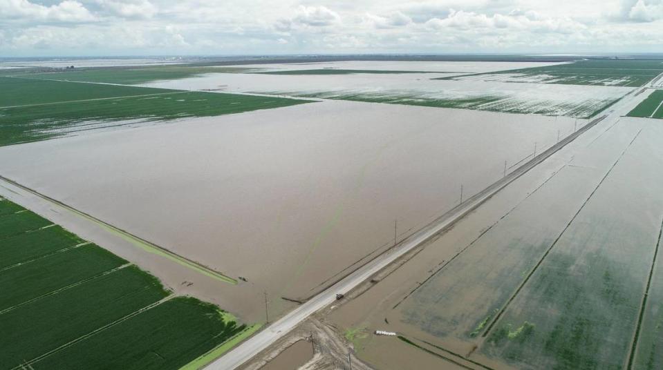 Floodwater fills sections of farmland on Avenue 10-1/2 in Kings County south of Hanford on Thursday, March 23, 2023.