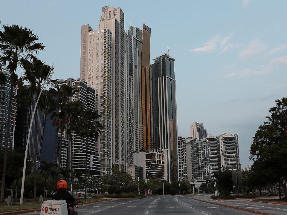 FILE PHOTO: A man drives his motorcycle along an empty avenue during the curfew as the coronavirus disease (COVID-19) outbreak continues, in Panama City, Panama March 31, 2020. REUTERS/Erick Marciscano