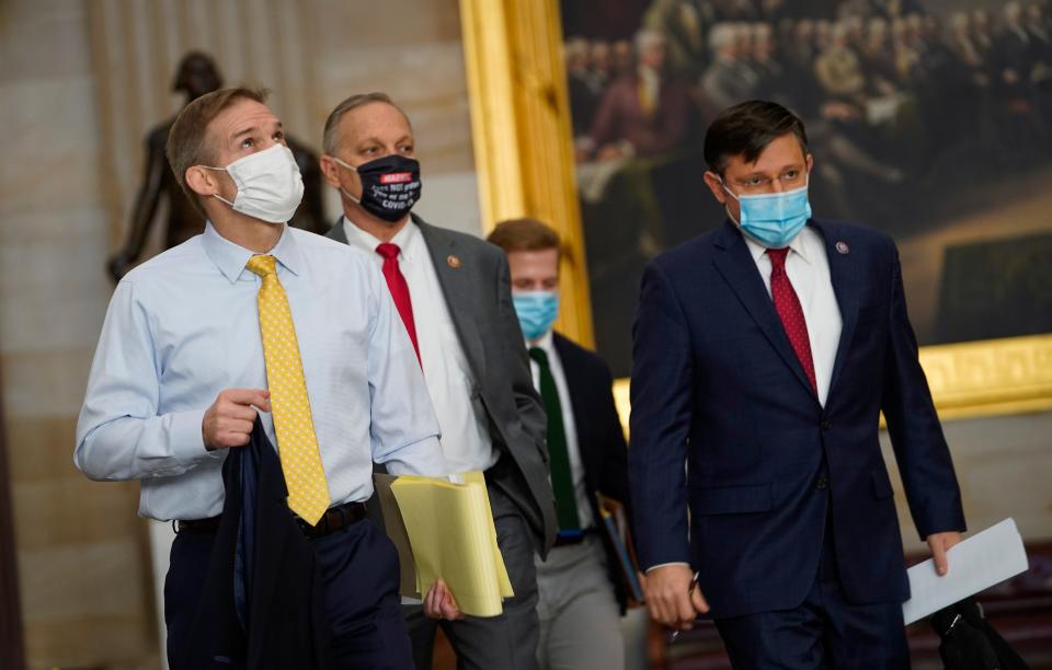 Congressmen Jim Jordan (R-OH), left, Andy Biggs, (R-AZ), center, and Mike Johnson, (R-LA), right, walk through the United States Capitol rotunda on the way to the Senate Chambers to begin the second impeachment trial of former President Donald Trump on Feb. 9, 2021