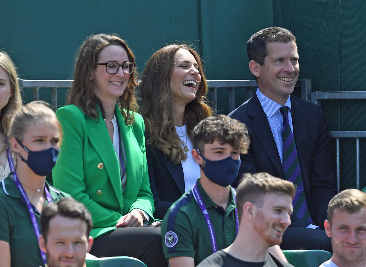 The Duchess of Cambridge (centre) and Tim Henman (right) attending day five of Wimbledon at The All England Lawn Tennis and Croquet Club, Wimbledon.