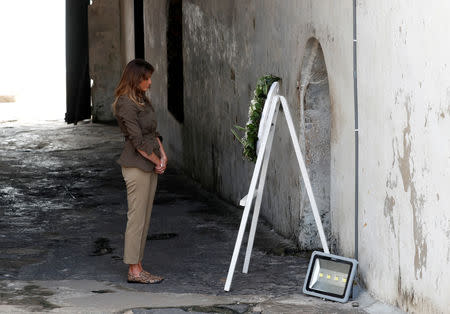 U.S. first lady Melania Trump lays a wreath during a visit to Cape Coast castle, Ghana, October 3, 2018. REUTERS/Carlo Allegri