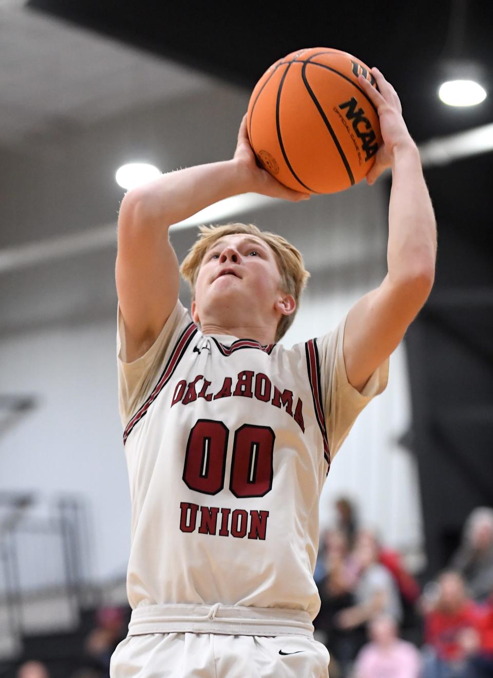 Oklahoma Union High School's Jake Harris (00) takes a shot during basketball action against Fairland during the Ty Hewitt Memorial Tournament in Nowata on Dec. 4, 2023. The Cougars fell to Fairland, 63-49. The annual tournament runs Dec. 4-9, 2023.