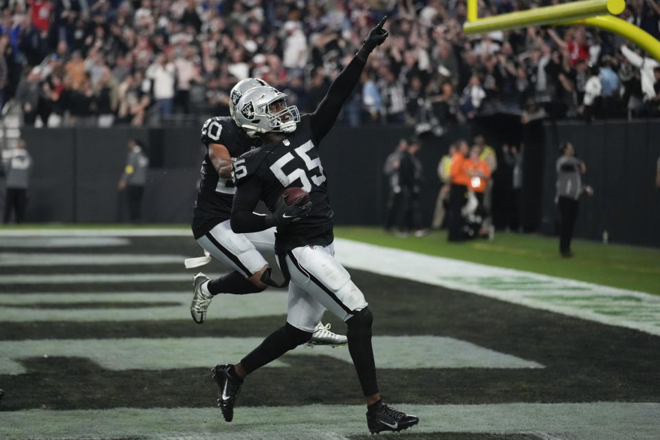 Las Vegas Raiders defensive end Chandler Jones celebrates after scoring on an interception during the second half of an NFL football game between the New England Patriots and Las Vegas Raiders, Sunday, Dec. 18, 2022, in Las Vegas. The Raiders defeated the Patriots 30-24. (AP Photo/John Locher)