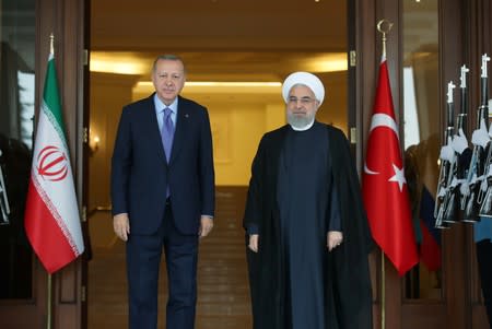 Turkish President Erdogan welcomes his Iranian counterpart Rouhani before their meeting in Ankara