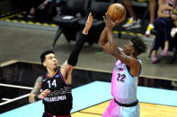 Miami Heat forward Jimmy Butler (22) shoots over Philadelphia 76ers forward Danny Green (14) during the first half of an NBA basketball game Thursday, May 13, 2021, in Miami. (AP Photo/Lynne Sladky)