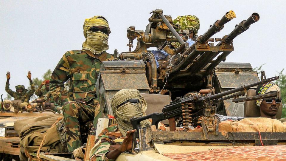 PHOTO: Fighters ride in a vehicle moving in a military convoy accompanying the governor of Sudan's Darfur State during a stopover in the eastern city of Gedaref while on the way to Port Sudan, on Aug. 30, 2023. (AFP via Getty Images)