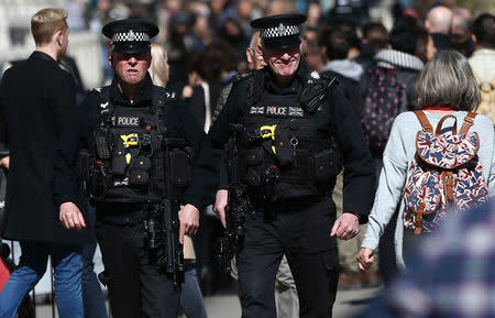 Armed police patrol the streets following the attack in Westminster earlier in the week, in central London, Britain March 26, 2017. REUTERS/Neil Hall