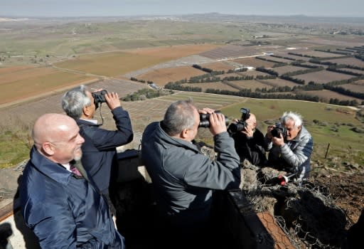 Avigdor Lieberman, Yisrael Beiteinu party leader and Israel's former defence minister, looks through binoculars during a visit to a looking point in Mount Bental in the Israeli-annexed Golan Heights, as part of his campaign for the upcoming Israeli election