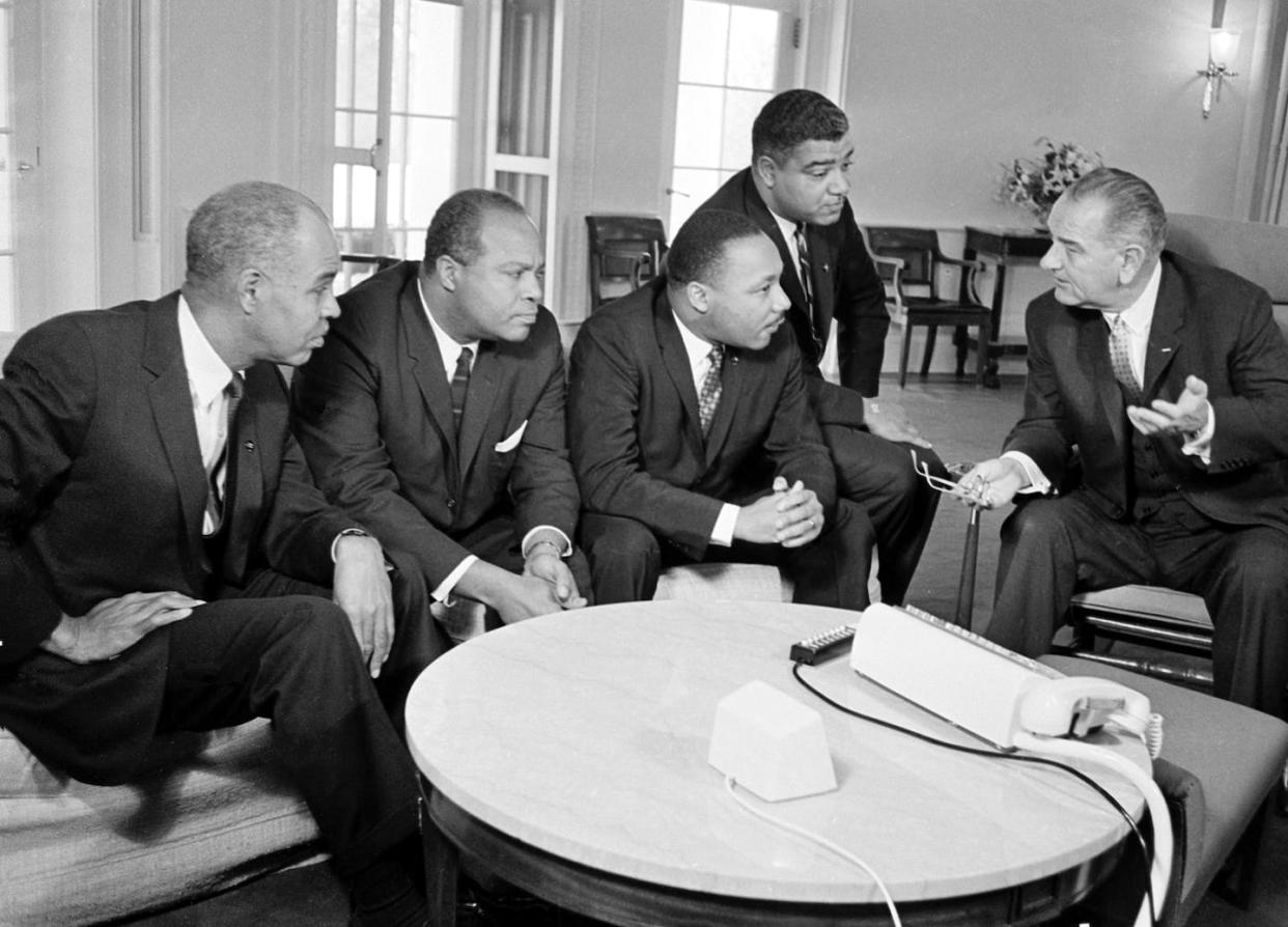 President Lyndon B. Johnson, right, talks with Martin Luther King Jr. and other civil rights leaders in his White House office in Washington, D.C., Jan. 18, 1964. <a href="https://newsroom.ap.org/detail/USPRESIDENTJOHNSONKING/d22cce379ce5da11af9f0014c2589dfb/photo?Query=King%20johnson&mediaType=photo&sortBy=&dateRange=Anytime&totalCount=689&currentItemNo=5" rel="nofollow noopener" target="_blank" data-ylk="slk:AP Photo;elm:context_link;itc:0;sec:content-canvas" class="link ">AP Photo</a>