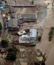 An aerial view shows a damaged home for the elderly (C) caused by a flood triggered by Typhoon Lionrock, where local media say nine bodies were found, in Iwaizumi town, Iwate prefecture, Japan, in this photo taken by Kyodo August 31, 2016. Mandatory credit Kyodo/via REUTERS