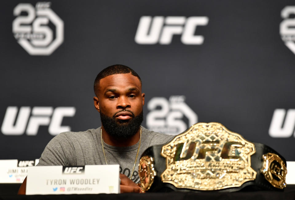 UFC welterweight champ <a href="https://sports.yahoo.com/tyron-woodley-admonishes-president-trump-203506991.html" data-ylk="slk:Tyron Woodley;elm:context_link;itc:0;sec:content-canvas;outcm:mb_qualified_link;_E:mb_qualified_link;ct:story;" class="link  yahoo-link">Tyron Woodley</a> interacts with the media during a UFC press conference inside the Orpheum Theater on Aug. 3, 2018, in Los Angeles, California. (Getty Images)