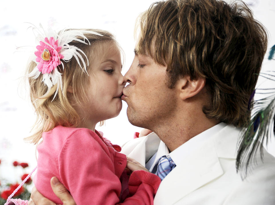 <p>In 2010, 3½-year-old Dannielynn made her Kentucky Derby debut wearing flowers in her blond hair. The little girl was already famous, both because of her mom — who died of a drug overdose when Dannielynn was just 5 months old — and because of the subsequent custody battle between Birkhead and Howard K. Stern, who was initially listed as Dannielynn’s father on her birth certificate. In April 2007, DNA results proved that Birkhead was the girl’s father. (Photo: Jeff Gentner/Getty Images) </p>