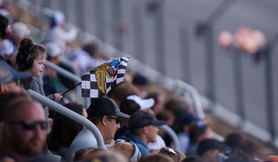 A young fan watches as Ed Carpenter Racing driver Rinus VeeKay (21) makes his way around the track Sunday, May 22, 2022, during the second day of qualifying for the 106th running of the Indianapolis 500 at Indianapolis Motor Speedway.