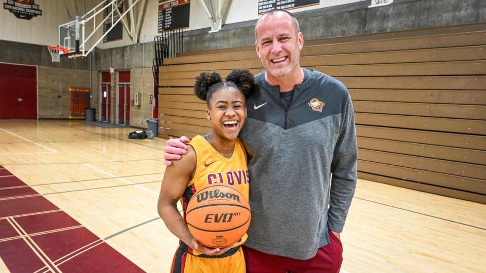 Clovis West girls basketball player Athena Tomlinson, The Fresno Bee’s high school girls basketball Player of the Year, is photographed with coach Craig Campbell, named Coach of the Year, on Monday, March 27, 2023. CRAIG KOHLRUSS/ckohlruss@fresnobee.com
