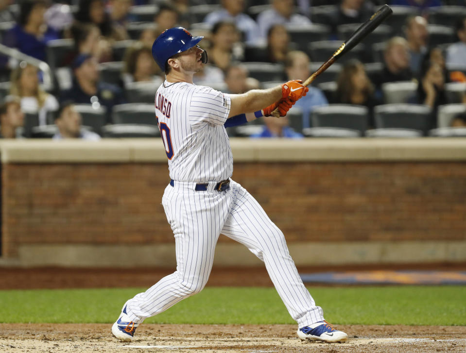 New York Mets' Pete Alonso (20) watches his three-run home run in the second inning of the team's baseball game against the Miami Marlins, Wednesday, Sept. 25, 2019, in New York. (AP Photo/Kathy Willens)