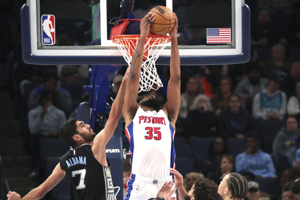 Detroit Pistons forward Marvin Bagley III (35) shoots while defended by Memphis Grizzlies forward Santi Aldama (7) during the first half of an NBA basketball game Friday, Dec. 9, 2022, in Memphis, Tenn. (AP Photo/Nikki Boertman)