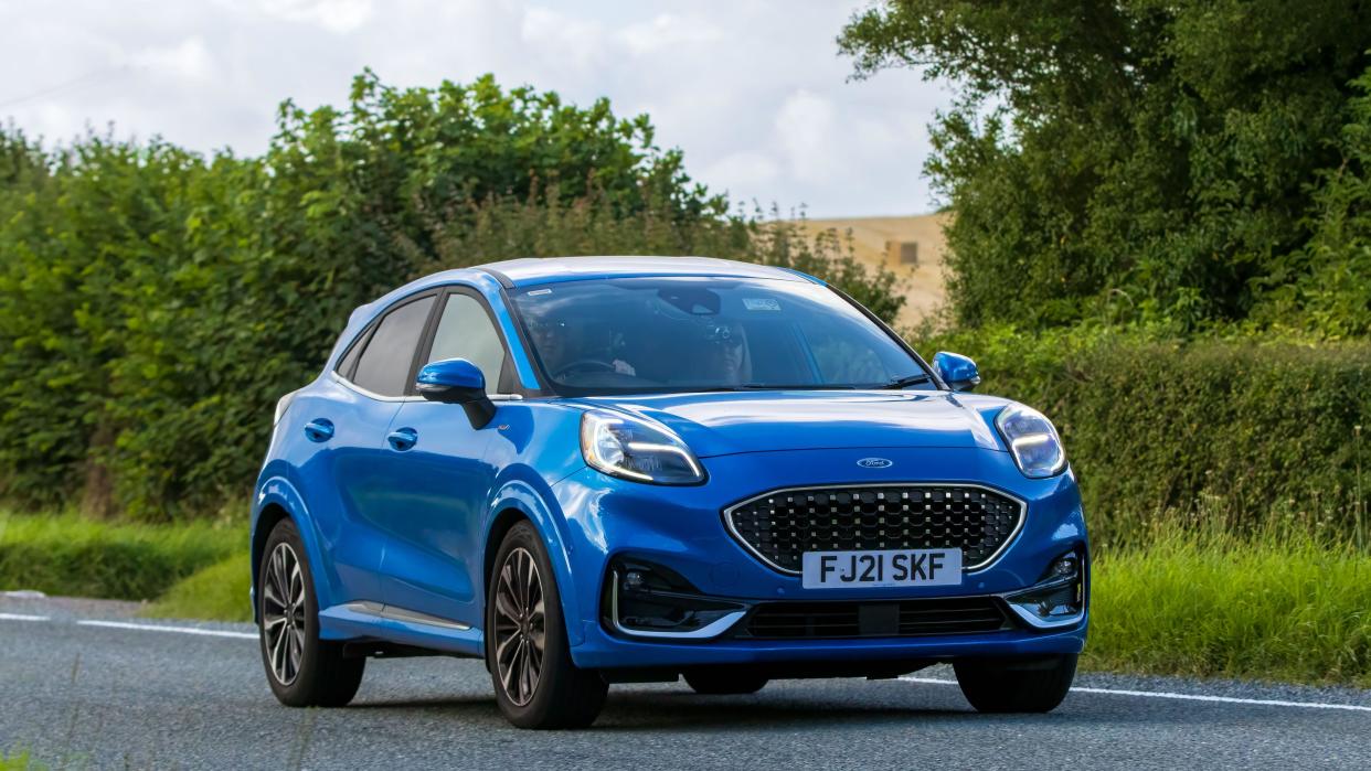 Woburn,Beds.UK - August 19th 2023:  2021 blue Ford Puma car travelling on an English country road.