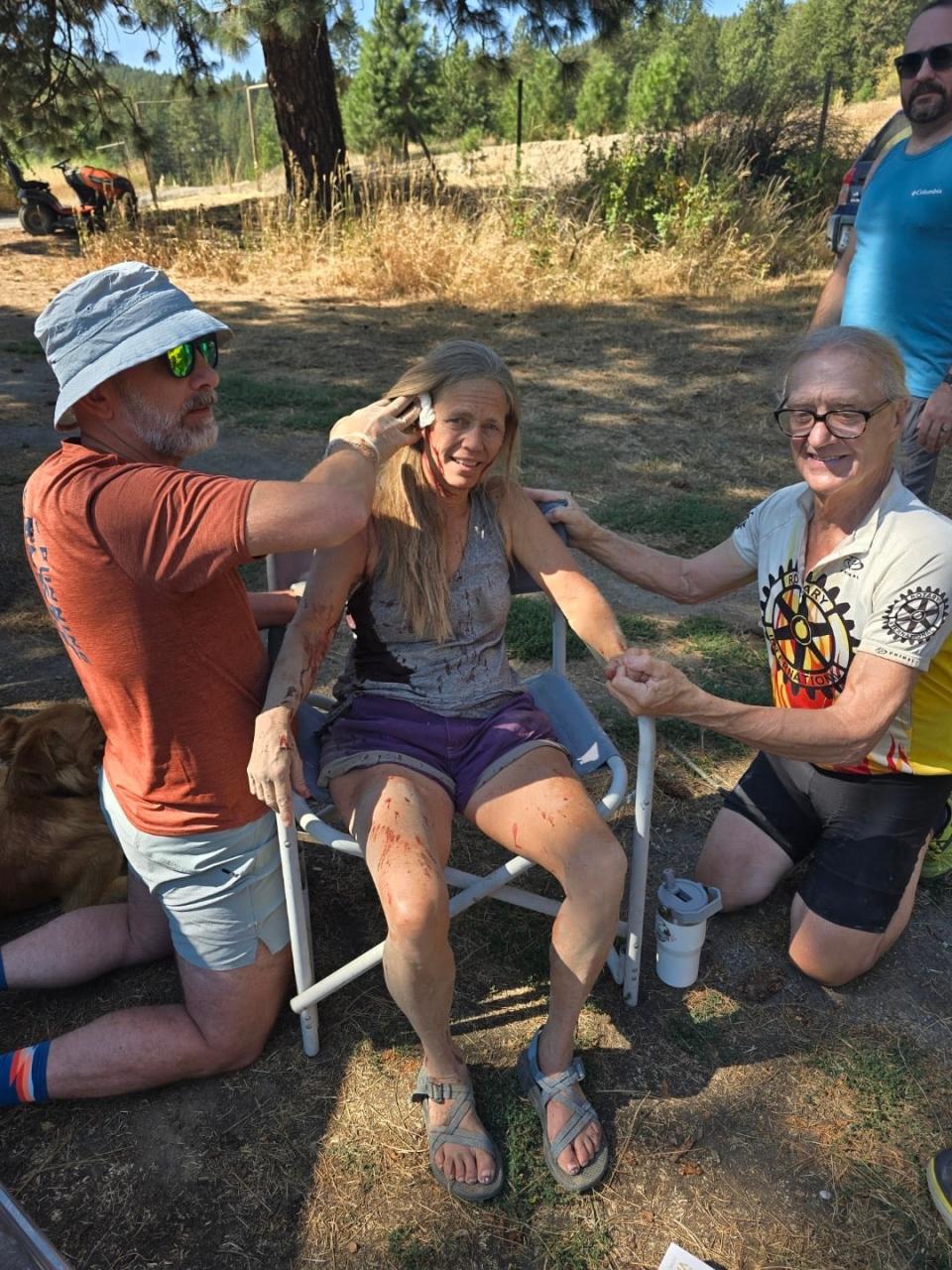 Lynn O'Connor is pictured getting treated and cleaned up by her family.