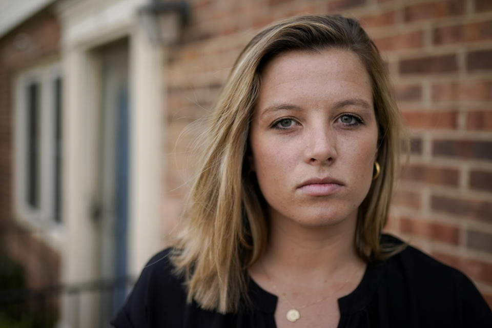 FILE - Shannon Keeler poses for a portrait in the United States, April 7, 2021. Two years after the former Gettysburg College student finally saw charges filed over her 2013 campus sexual assault, the man suspected of sending her a Facebook messages that said, “So I raped you,” — Ian Cleary — remains on the run in 2023. (AP Photo, File)