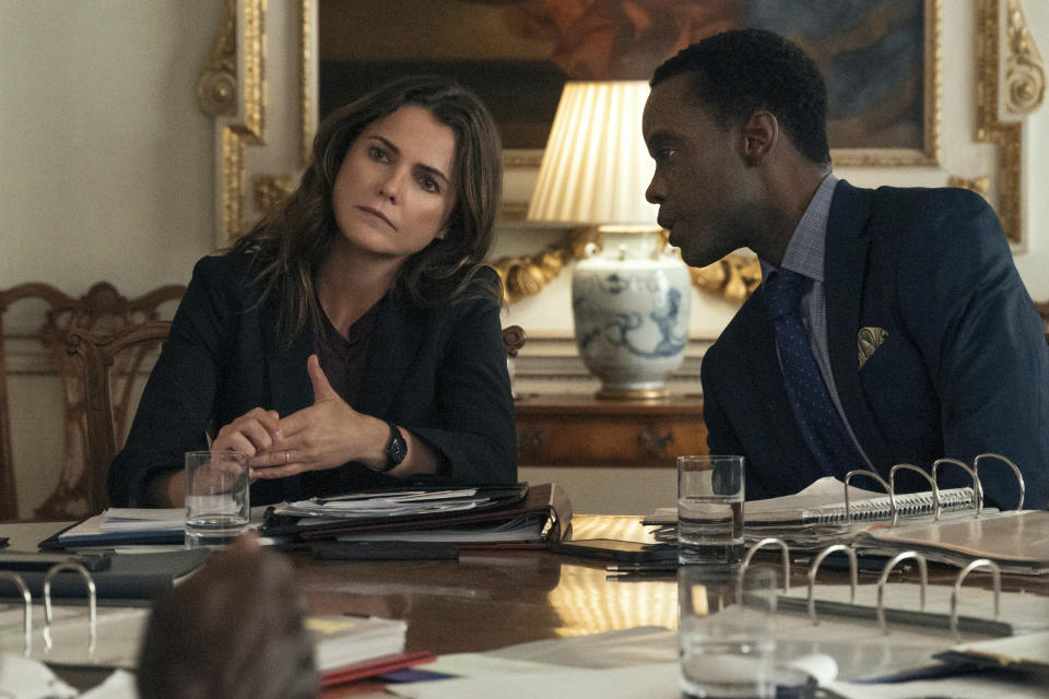 This image released by Netflix shows Keri Russell as Ambassador Kate Wyler, left, and Ato Essandoh as Stuart Heyford in a scene from "The Diplomat." (Netflix via AP)