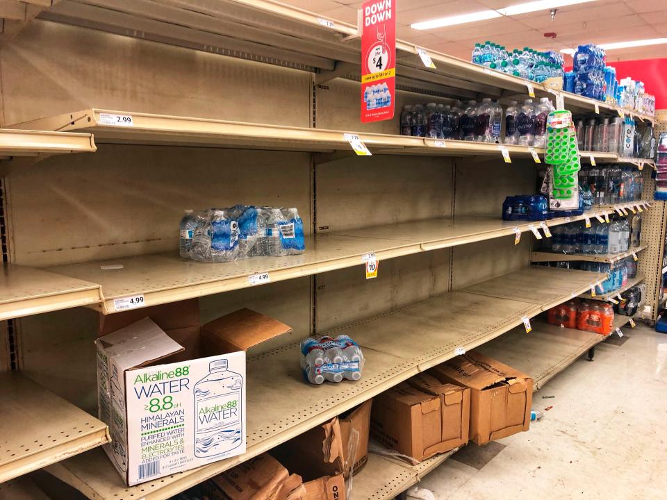 The shelves are nearly empty of water at the Winn Dixie in State Road 84 in Fort Lauderdale Thursday as people stock up on water due to a water main break.