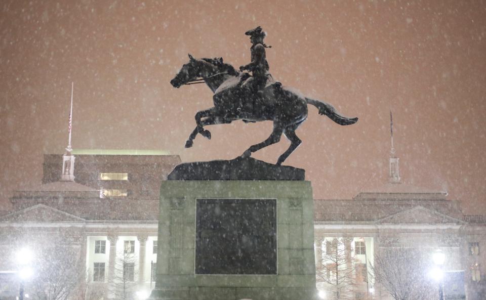 Snow falls over Rodney Square in Wilmington during weather fit for a cold-weather version of Caesar Rodney's ride during a winter storm.