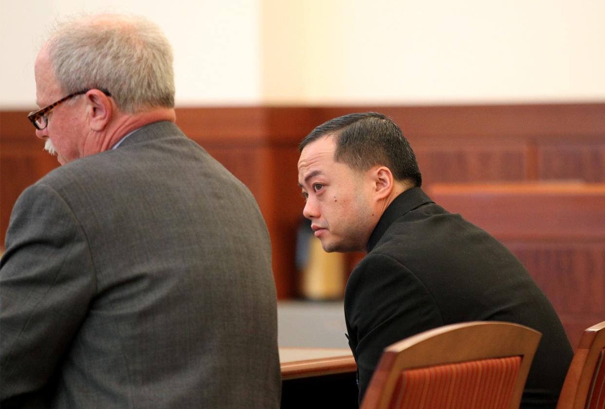 John Yang, right, during a 2013 arson trial.