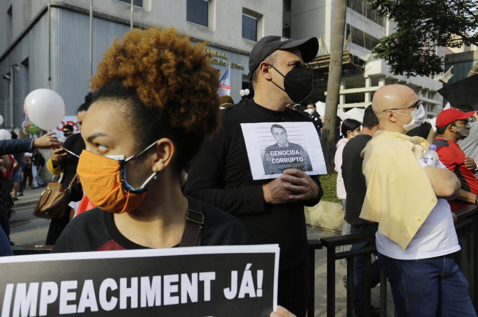 People protest demanding that Brazilian President Jair Bolsonaro resign, in Sao Paulo, Brazil, Saturday, July 3, 2021. Activists called for nationwide demonstrations against Bolsonaro, gathering protestors to demand his impeachment amid allegations of potential corruption in the Health Ministry’s purchase of COVID-19 vaccines. (AP Photo/Nelson Antoine)