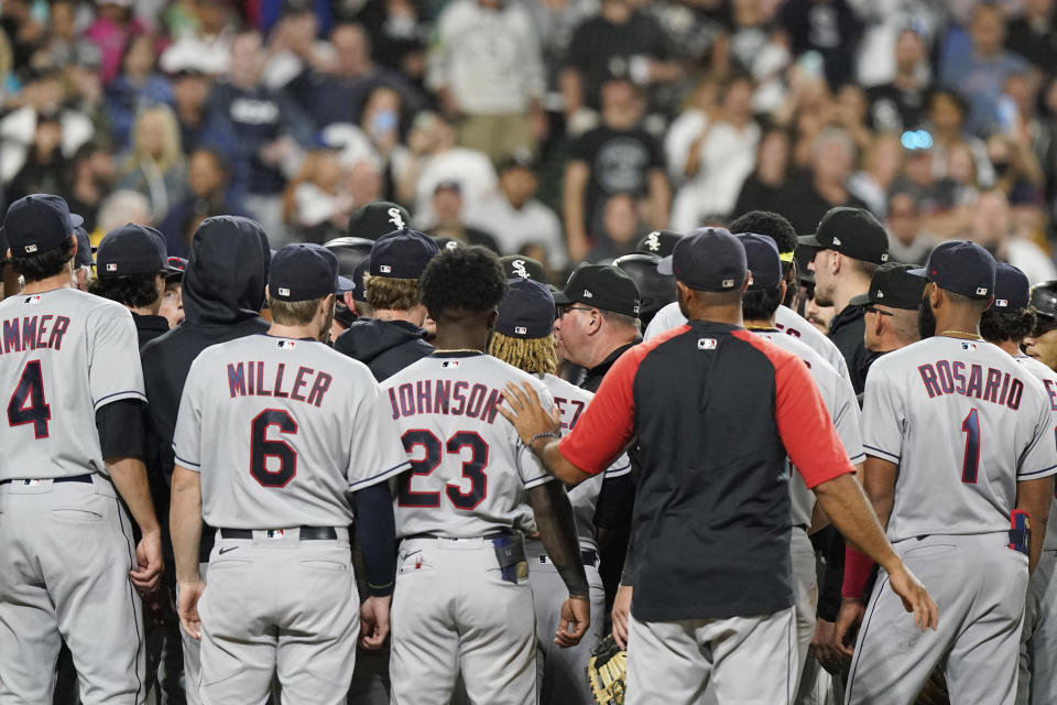 Chicago White Sox and Cleveland Indians gather after Chicago White Sox's Jose Abreu was hit by a pitch thrown by Cleveland Indians reliever James Karinchak during the eighth inning of a baseball game in Chicago, Friday, July 30, 2021. The Chicago White Sox won 6-4. (AP Photo/Nam Y. Huh)