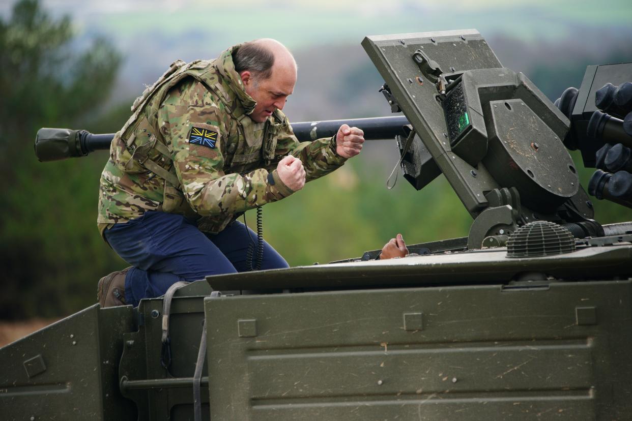 Defence secretary Ben Wallace speaks to the crew inside an Ajax armoured personnel carrier after a demonstration during a visit to Bovington Camp in Dorset (Getty Images)