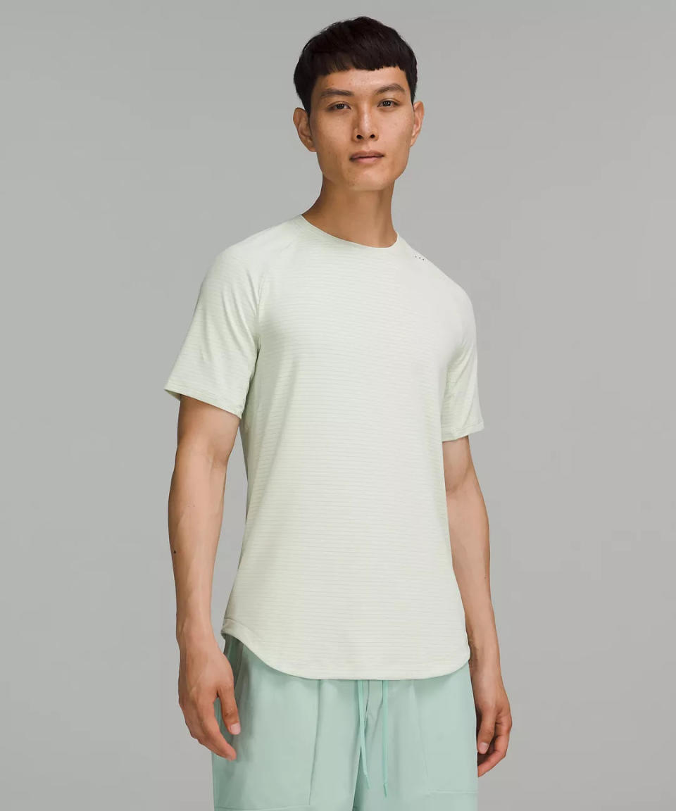 model wears mint green Drysense Short Sleeve Shirt. 