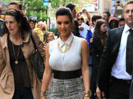 Kim Kardashian To Become A Surrogate Mum? 