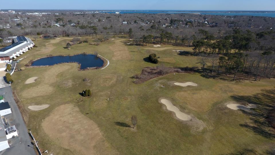 An aerial view looks southeast across Twin Brooks Golf Course toward Hyannis Harbor. Developers have dropped plans to build a 312-unit apartment complex proposed for 40-acre course. Riverview School, which serves people with learning disabilities, will buy the property.