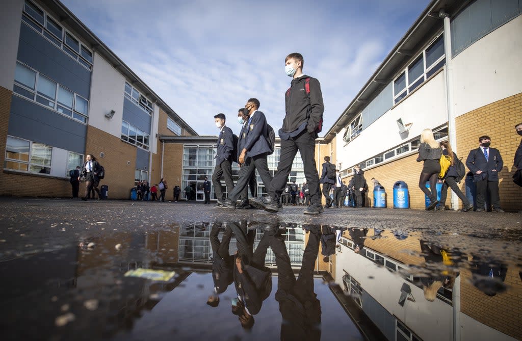 Students arriving at St Andrew’s RC Secondary School in Glasgow (PA)