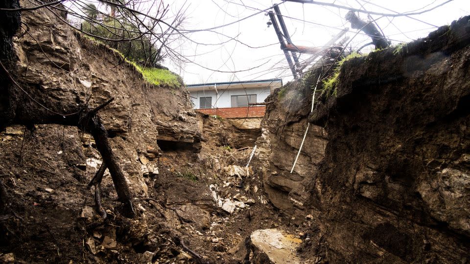 A house stands on top of a landslide in Encino on Monday. - Aude Guerrucci/Reuters