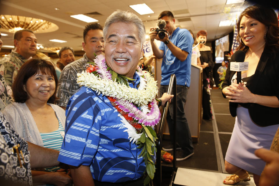 Hawaii Gov. David Ige greets supporters at his campaign headquarters, Saturday, Aug. 11, 2018, in Honolulu. (AP Photo/Marco Garcia)