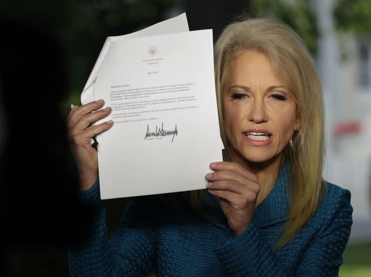 During an interview with CNN on May 10, 2017, Kellyanne Conway holds up a copy of the termination letter that President Trump had sent to FBI Director James Comey. (Alex Wong/Getty Images)