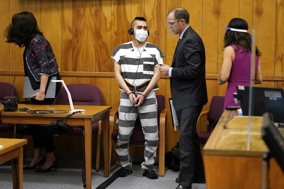 Cristhian Bahena Rivera, center, prepares to leave the courtroom after his sentencing, Monday, Aug. 30, 2021, at the Poweshiek County Courthouse in Montezuma, Iowa. Rivera was sentenced to life in prison for the stabbing death of college student Mollie Tibbetts, who was abducted as she was out for a run near her small eastern Iowa hometown in July of 2018. (AP Photo/Charlie Neibergall, pool)