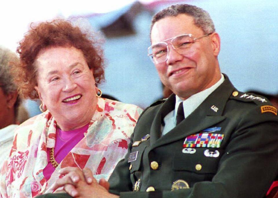 Colin Powell laughs with chef Julia Child during a Harvard University Graduation (AFP via Getty Images)