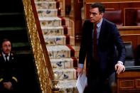 Spanish PM Sanchez leaves his seat during a session on coronavirus disease (COVID-19) at Parliament in Madrid