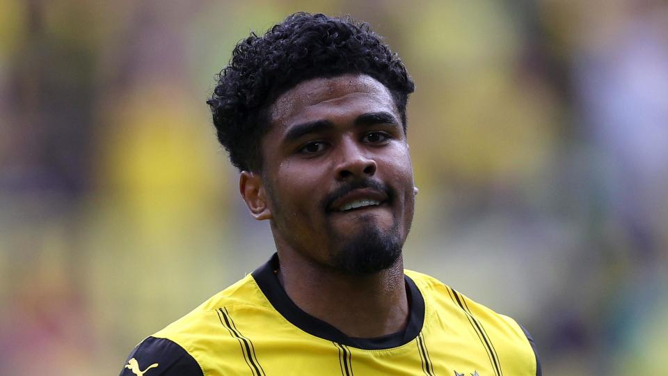 A head and shoulders picture of Ian Maatsen looking at the camera with his bottom lip tucked in while playing for Borussia Dortmund