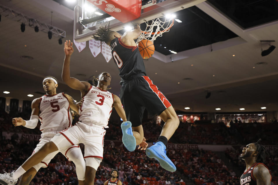 Texas Tech guard Chance McMillian (0) dunks the ball next to Oklahoma guards Rivaldo Soares (5) and Otega Oweh (3) as Texas Tech guard Joe Toussaint, lower right, looks on during the first half of an NCAA college basketball game, Saturday, Jan. 27, 2024, in Norman, Okla. (AP Photo/Nate Billings)