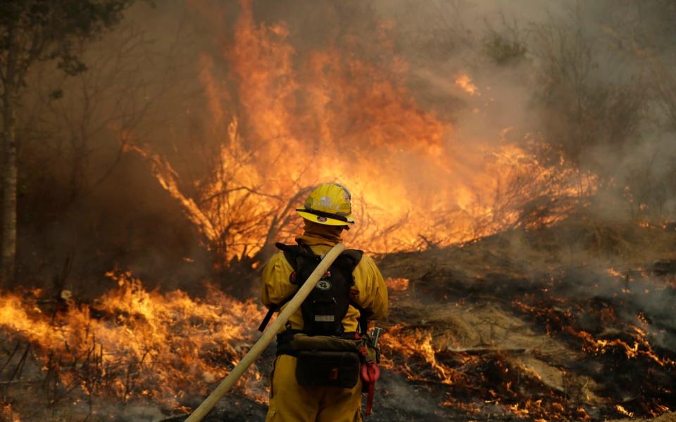 A firefighter monitors a