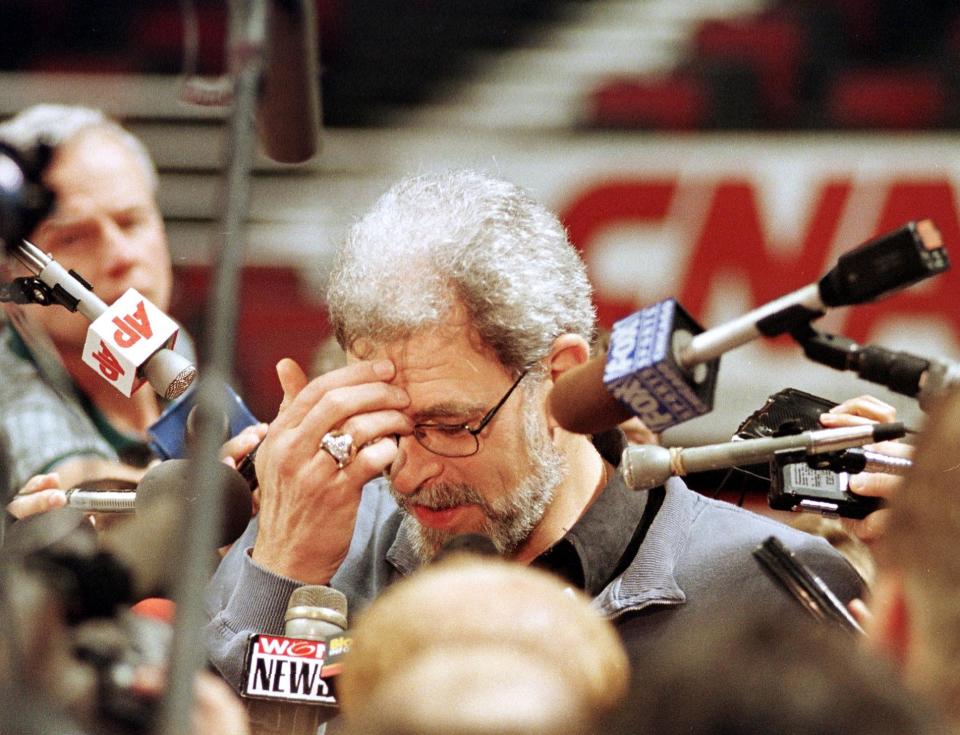 CHICAGO, UNITED STATES:  Chicago Bulls head coach Phil Jackson (C) is surrounded by reporters as he answers questions about Bulls player Dennis Rodman after their practice 09 June at the United Center in Chicago, IL. Rodman missed practice 08 June to appear on a World Championship Wrestling broadcast from Detroit, MI. Rodman was fined USD 10,000 by the NBA for his actions. The Bulls beat the Utah Jazz 96-54 in game three of the NBA Finals 07 June to take a 2-1 lead in the best-of-seven series.    AFP PHOTO Robert SULLIVAN (Photo credit should read ROBERT SULLIVAN/AFP via Getty Images)